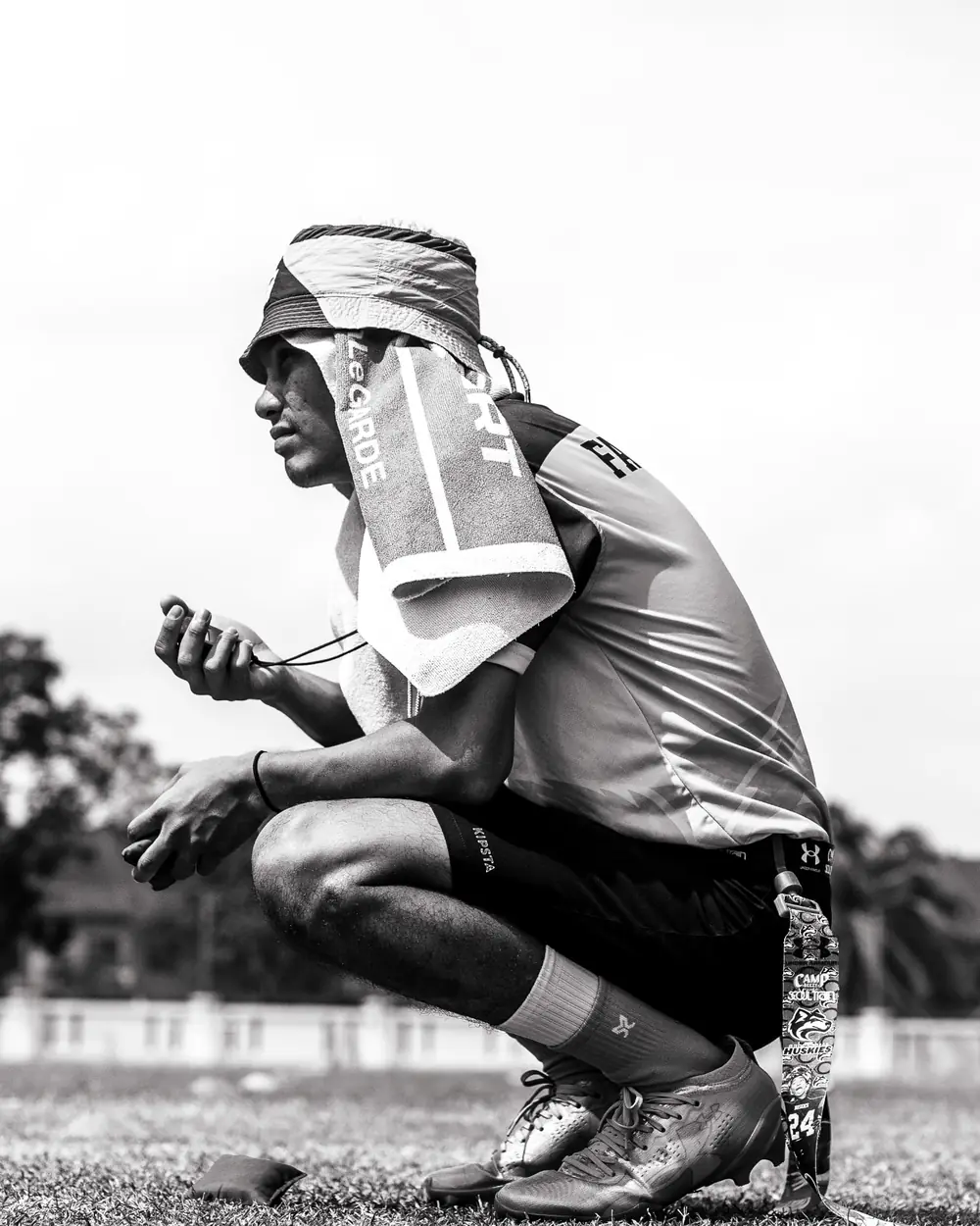 Flag football player taking a breather on the sideline